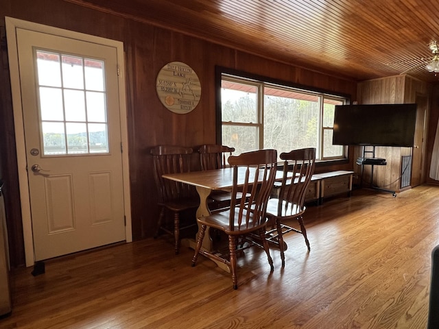 764 Cedar Hill Rd, Celina, TN 38551 - dining area with wood ceiling, wood finished floors, wooden walls, and plenty of natural light