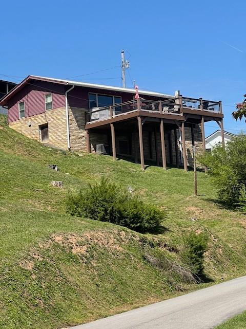 764 Cedar Hill Rd, Celina, TN 38551 - rear view of property with a yard, a deck, and stone siding