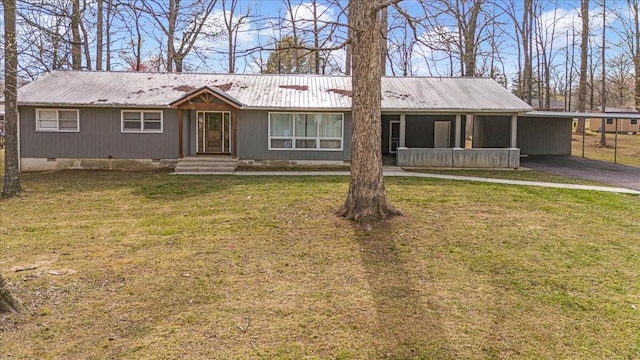 single story home featuring an attached carport, aphalt driveway, a front lawn, metal roof, and crawl space