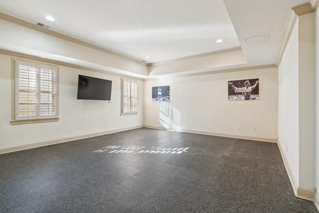 unfurnished room featuring baseboards, visible vents, crown molding, and a raised ceiling
