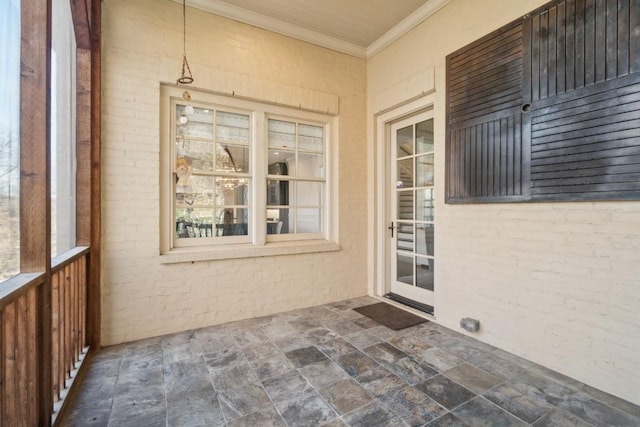 exterior space with stucco siding and a patio