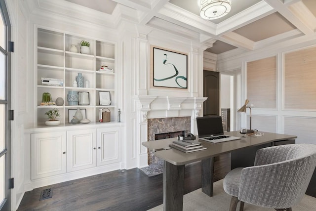 office with visible vents, a high end fireplace, beamed ceiling, dark wood-style floors, and coffered ceiling