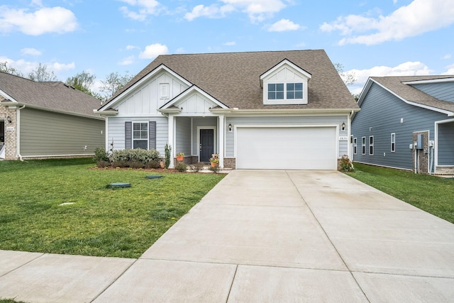 view of front of home with a garage, concrete driveway, a front yard, board and batten siding, and a shingled roof