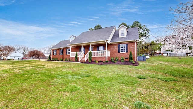 cape cod home with brick siding, a shingled roof, a front lawn, and a porch