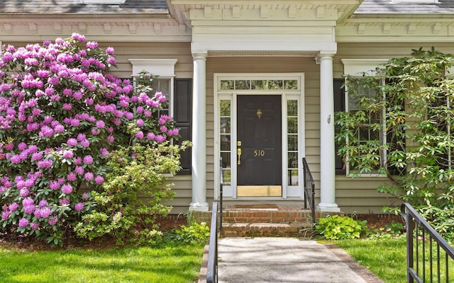property entrance with covered porch