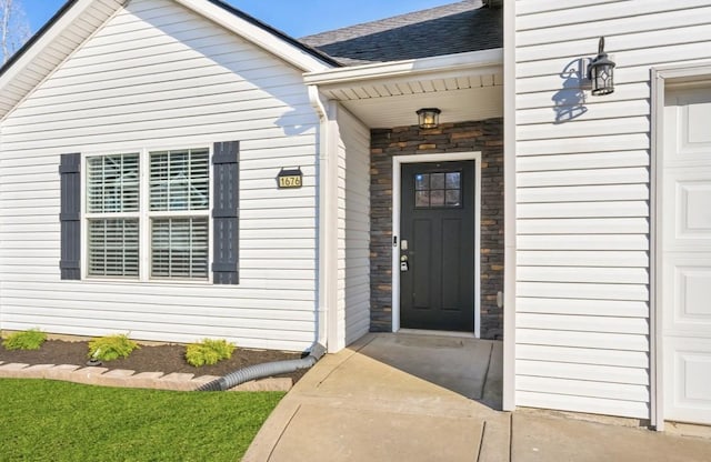 1676 Putnum Dr, Clarksville, TN 37042 - doorway to property with roof with shingles and stone siding