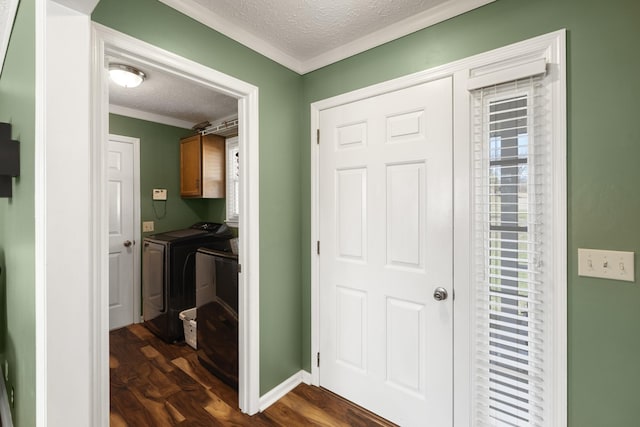 hallway featuring crown molding, baseboards, separate washer and dryer, dark wood finished floors, and a textured ceiling