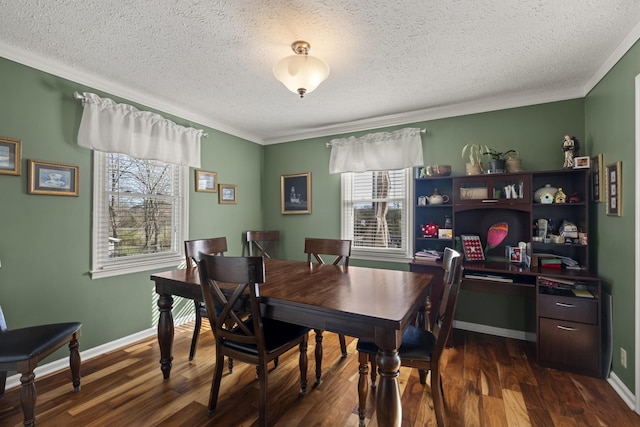 dining room with dark wood-type flooring, a textured ceiling, baseboards, and crown molding