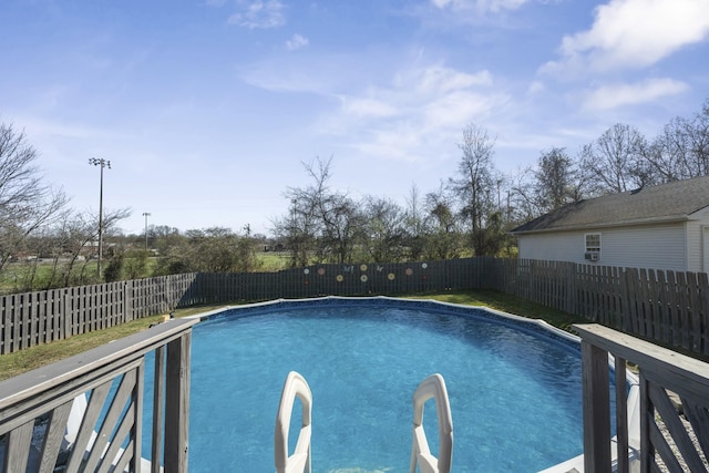 view of swimming pool featuring a fenced in pool and a fenced backyard