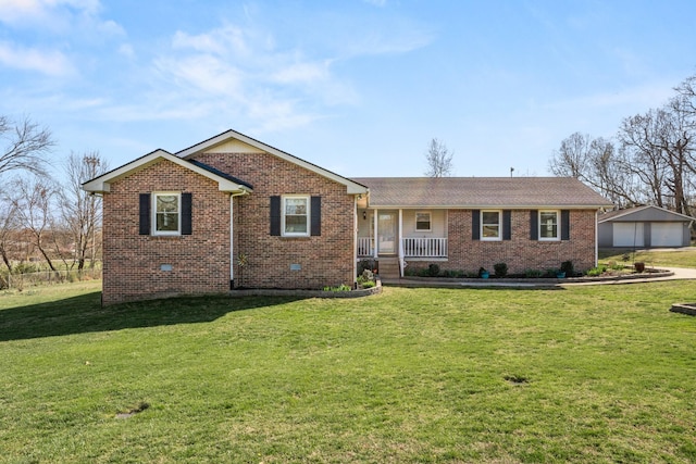ranch-style house featuring covered porch, an outdoor structure, brick siding, and a front yard
