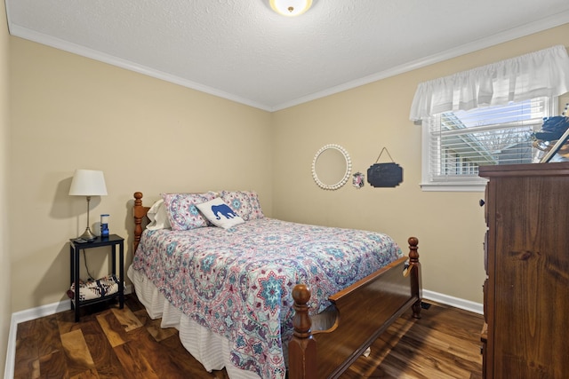 bedroom with ornamental molding, baseboards, and wood finished floors