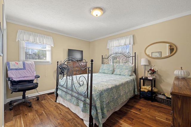 bedroom featuring wood finished floors, multiple windows, and crown molding