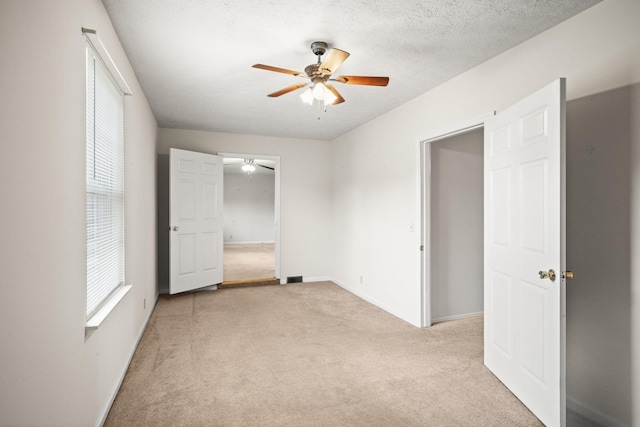 117 Rolling Meadows Ave, Portland, TN 37148 - unfurnished bedroom featuring light carpet, ceiling fan, and baseboards
