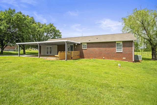 117 Rolling Meadows Ave, Portland, TN 37148 - rear view of house with french doors, central air condition unit, a yard, and an attached carport