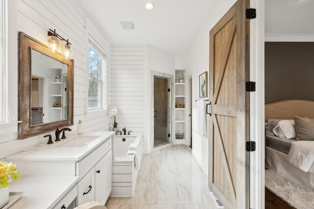 full bathroom featuring vanity, marble finish floor, a stall shower, wooden walls, and a garden tub