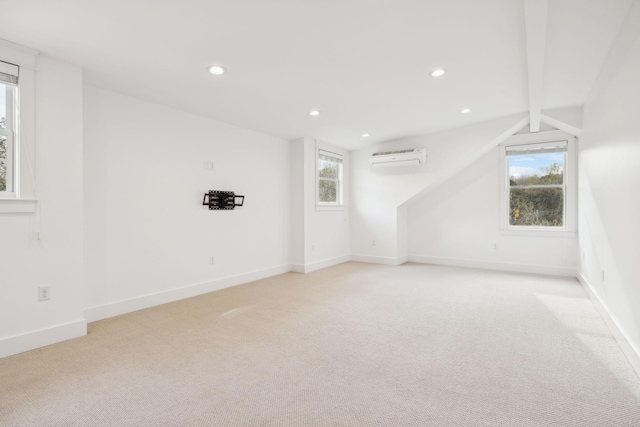 empty room with light carpet, beam ceiling, and recessed lighting