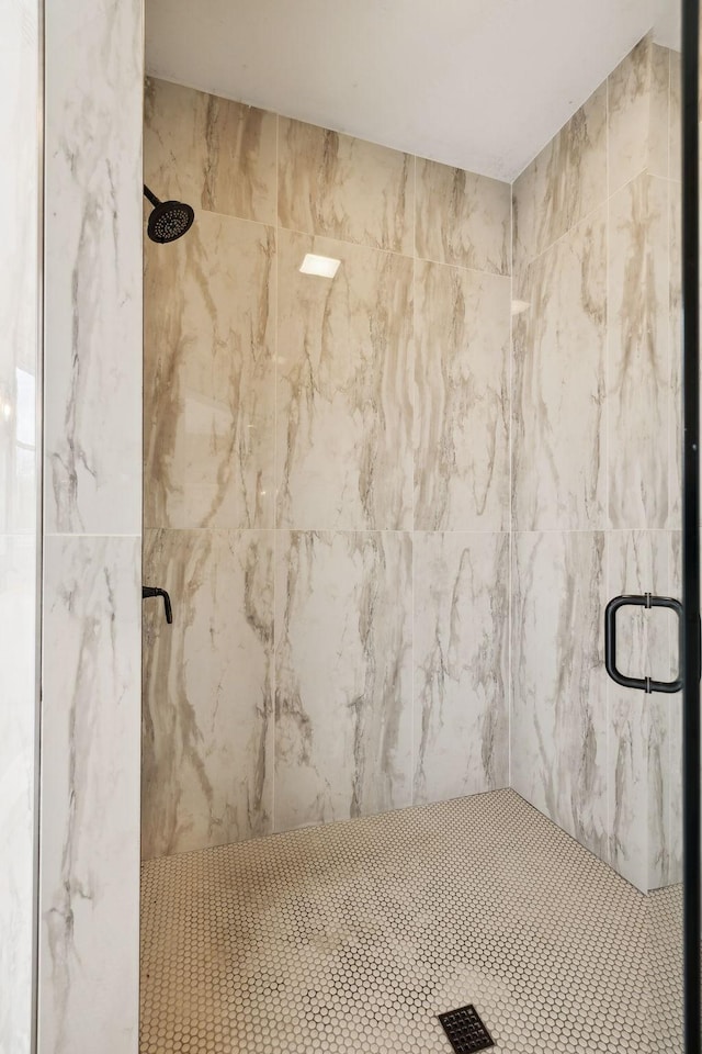 bathroom with visible vents and a shower stall