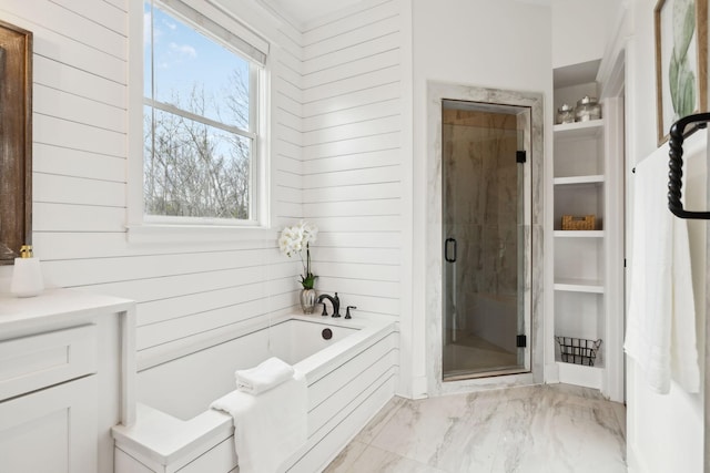 full bath with a shower stall, marble finish floor, wood walls, and a bath