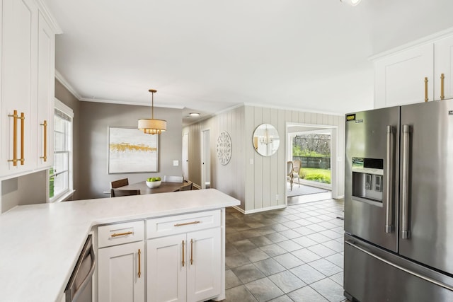 kitchen featuring white cabinetry, light countertops, a peninsula, and stainless steel appliances