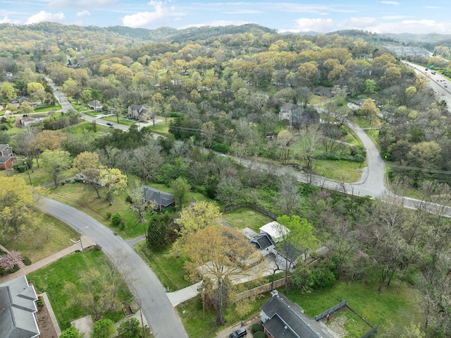 birds eye view of property with a wooded view