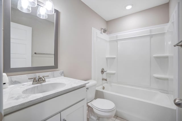 bathroom featuring toilet, vanity, and shower / bath combination