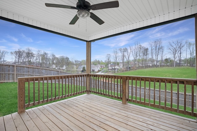 deck featuring a lawn, a fenced backyard, and a ceiling fan