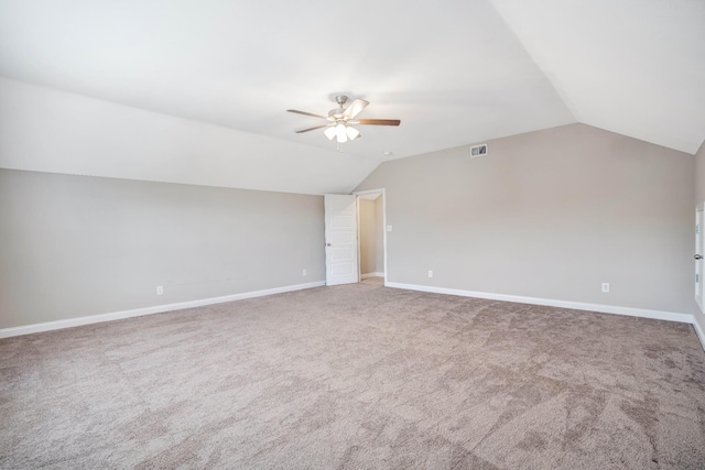 bonus room featuring baseboards, visible vents, ceiling fan, and vaulted ceiling