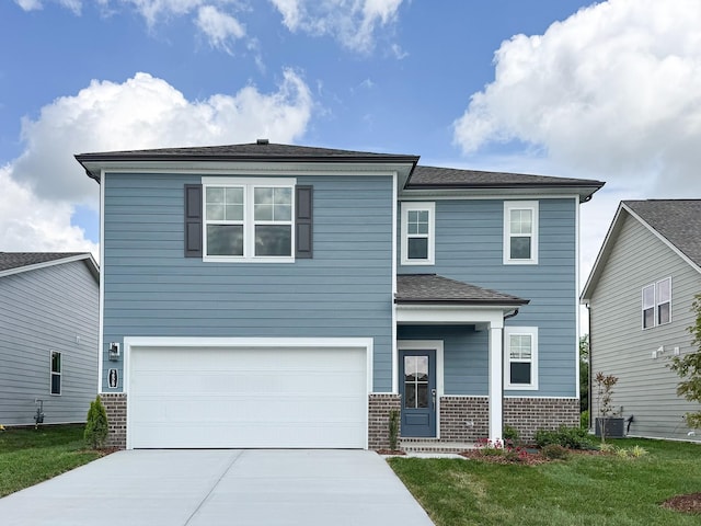 258 Subban Ct, Lebanon, TN 37087 - view of front facade with concrete driveway, brick siding, an attached garage, and central AC