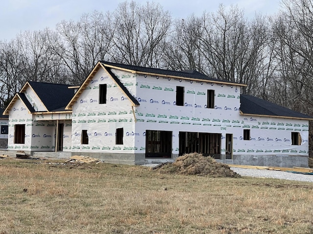 property in mid-construction featuring a front lawn