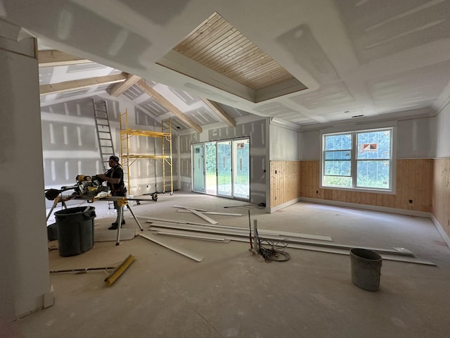 49 Copperas Creek Rd, Tullahoma, TN 37388 - living room with a wainscoted wall, wooden walls, and vaulted ceiling