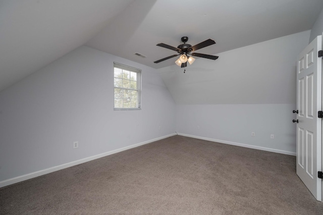 bonus room with ceiling fan, baseboards, lofted ceiling, and visible vents