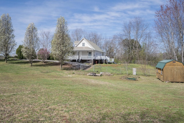 view of yard with an outbuilding and a storage shed