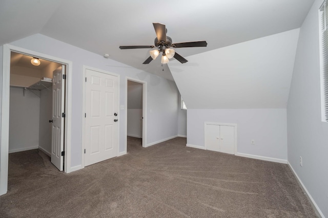 bonus room with baseboards, lofted ceiling, a ceiling fan, and carpet floors