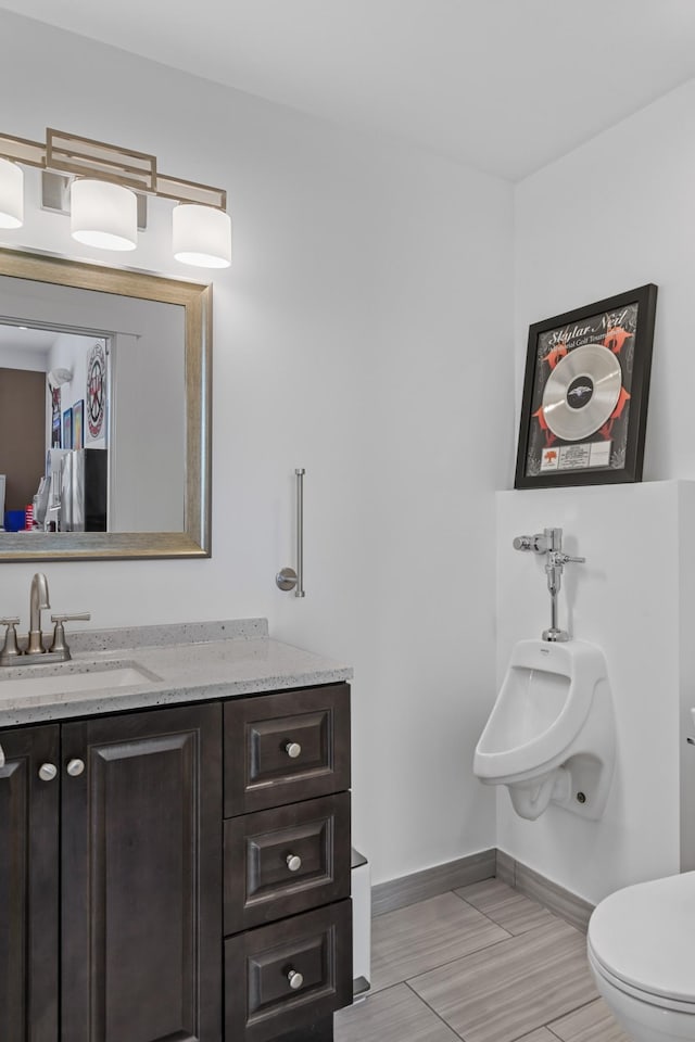 7990 Poplar Creek Rd, Nashville, TN 37221 - bathroom with baseboards, toilet, and vanity