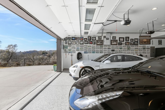 7990 Poplar Creek Rd, Nashville, TN 37221 - garage featuring fence and a garage door opener