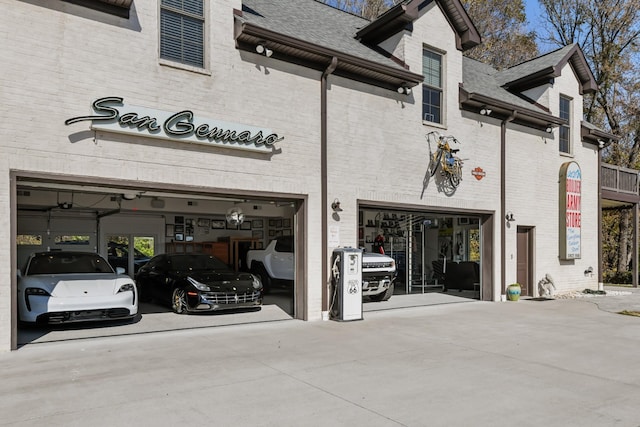 7990 Poplar Creek Rd, Nashville, TN 37221 - view of building exterior featuring an attached garage and concrete driveway