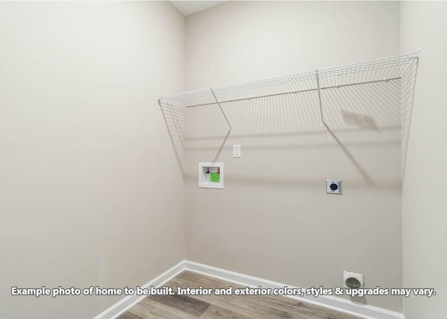 washroom featuring washer hookup, wood finished floors, electric dryer hookup, laundry area, and baseboards