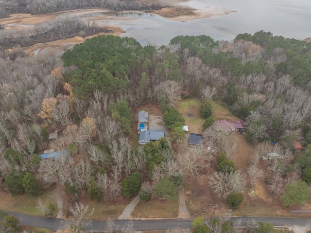 birds eye view of property with a forest view