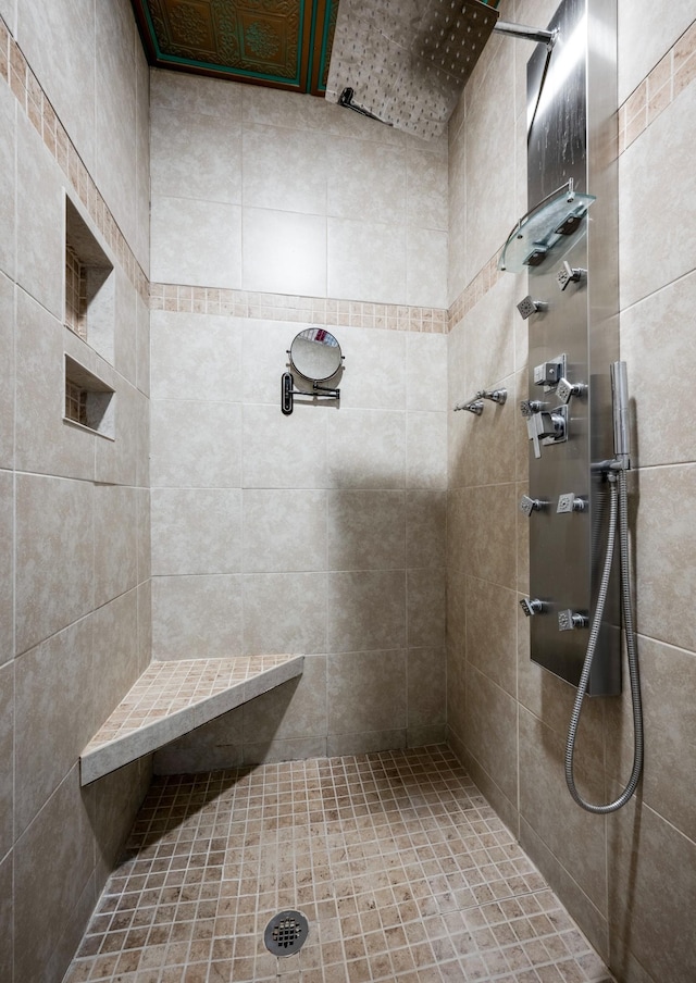 bathroom featuring tiled shower