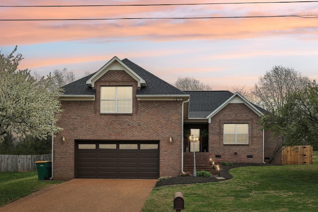 view of front of home with roof with shingles, concrete driveway, fence, a front lawn, and a garage