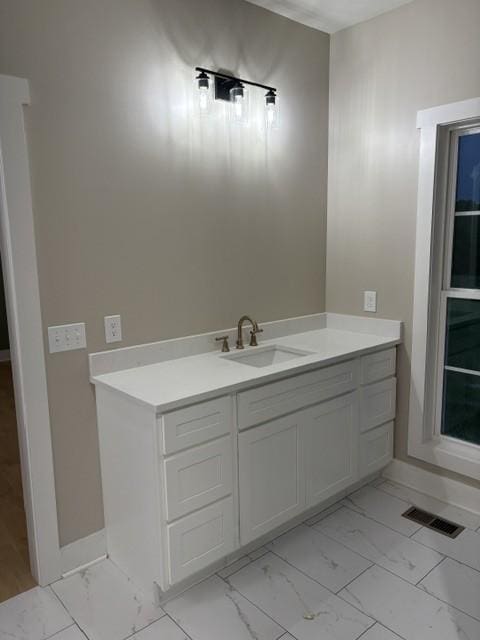 bathroom with visible vents, marble finish floor, baseboards, and vanity