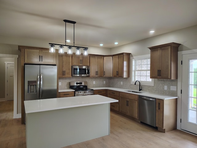 1452 Purtle Rd, Lafayette, TN 37083 - kitchen featuring appliances with stainless steel finishes, a sink, backsplash, a center island, and recessed lighting