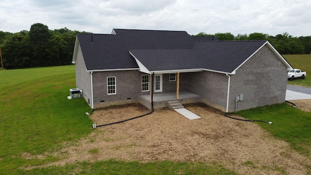 1452 Purtle Rd, Lafayette, TN 37083 - view of front of home featuring crawl space, brick siding, central AC unit, and a front yard