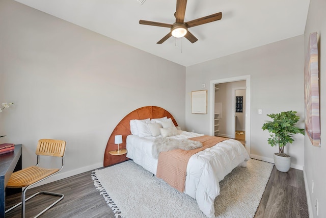 1900 12th Ave S Unit 404, Nashville, TN 37203 - bedroom featuring baseboards, a ceiling fan, and wood finished floors