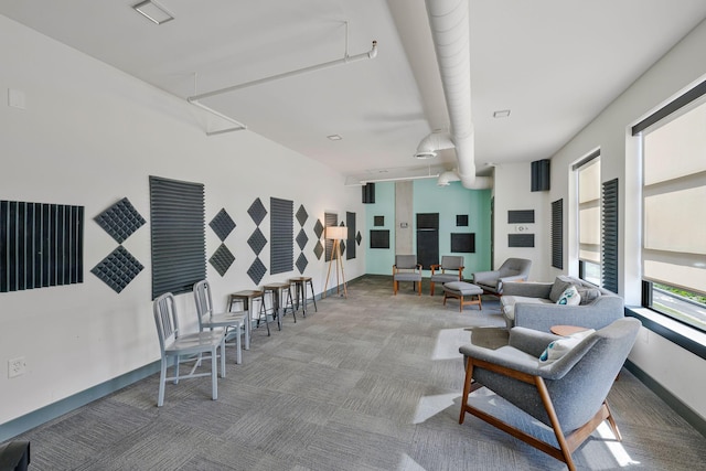 1900 12th Ave S Unit 404, Nashville, TN 37203 - carpeted living area featuring attic access and baseboards