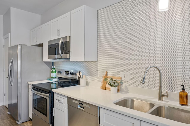 1900 12th Ave S Unit 404, Nashville, TN 37203 - kitchen with white cabinetry, appliances with stainless steel finishes, light countertops, and a sink