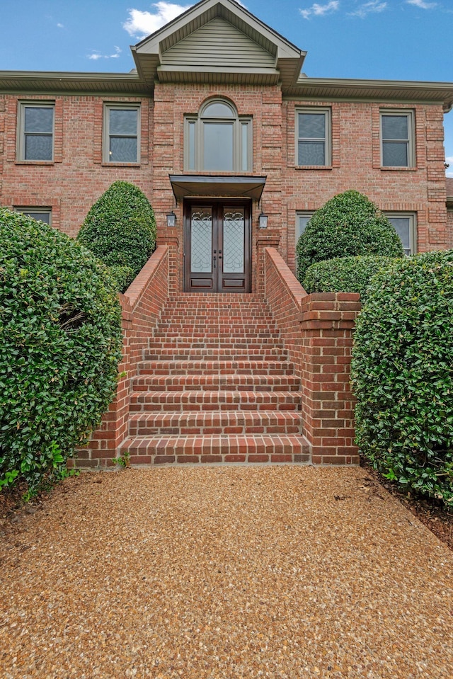 view of front of house with brick siding