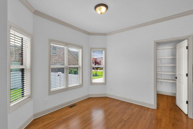 2726 Wynthrope Hall Dr, Murfreesboro, TN 37129 - empty room featuring crown molding, plenty of natural light, wood finished floors, and baseboards