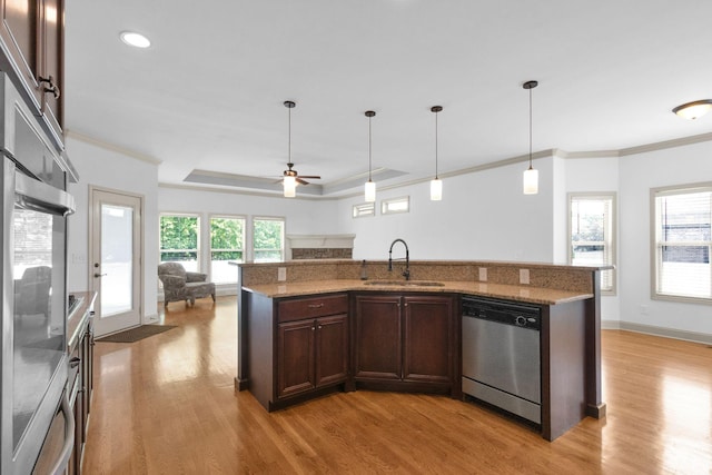 2726 Wynthrope Hall Dr, Murfreesboro, TN 37129 - kitchen with dishwasher, a sink, open floor plan, light wood-style floors, and crown molding