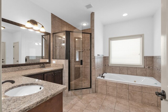 2726 Wynthrope Hall Dr, Murfreesboro, TN 37129 - bathroom featuring a tub with jets, double vanity, a stall shower, and tile patterned floors